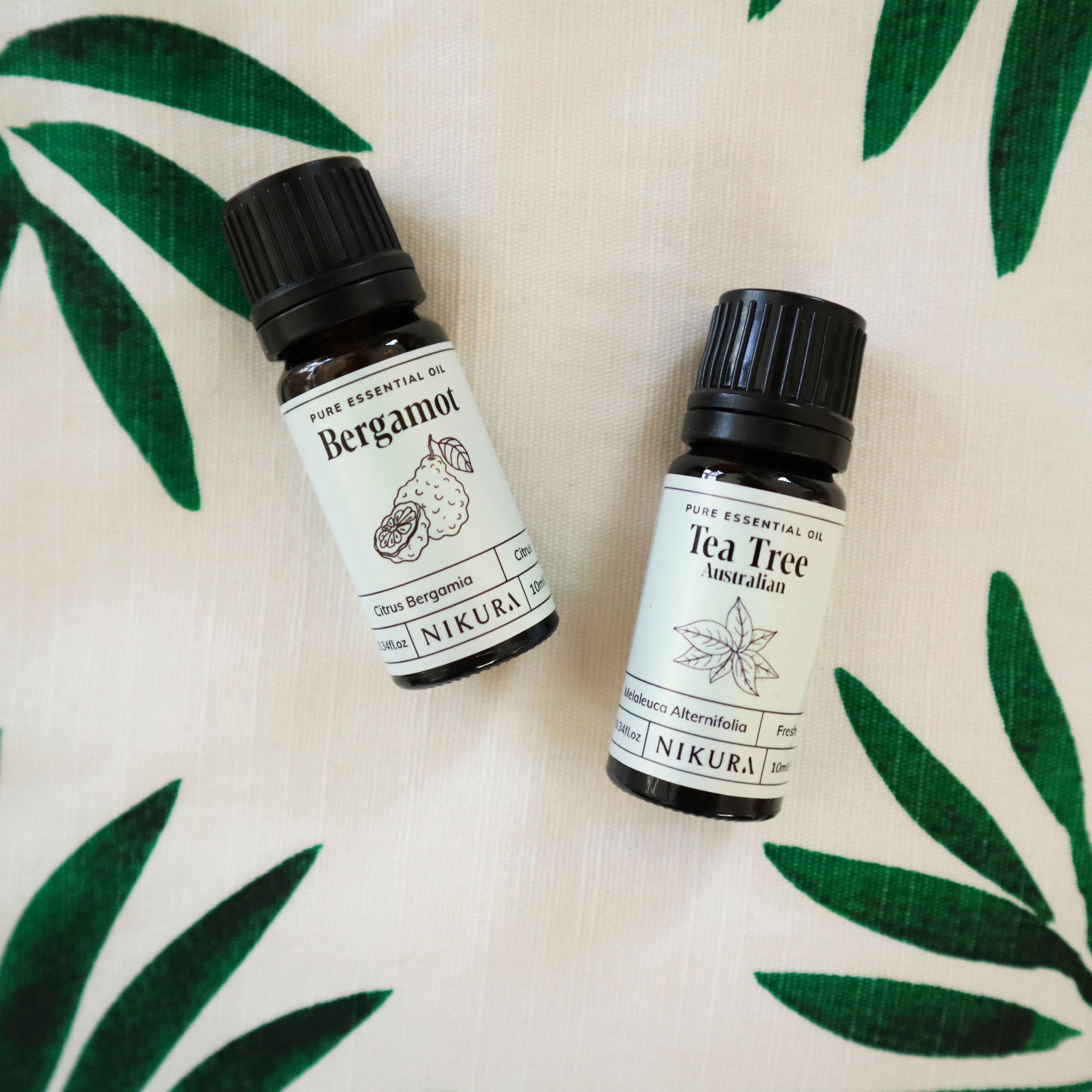 Amber Glass bottles with dried patchouli herbs surrounding